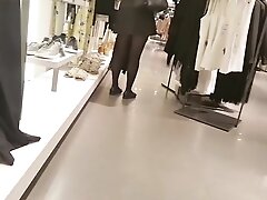 Shopper in shiny opaque black pantyhose and upskirt