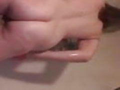 Mature chick rubs in the shower